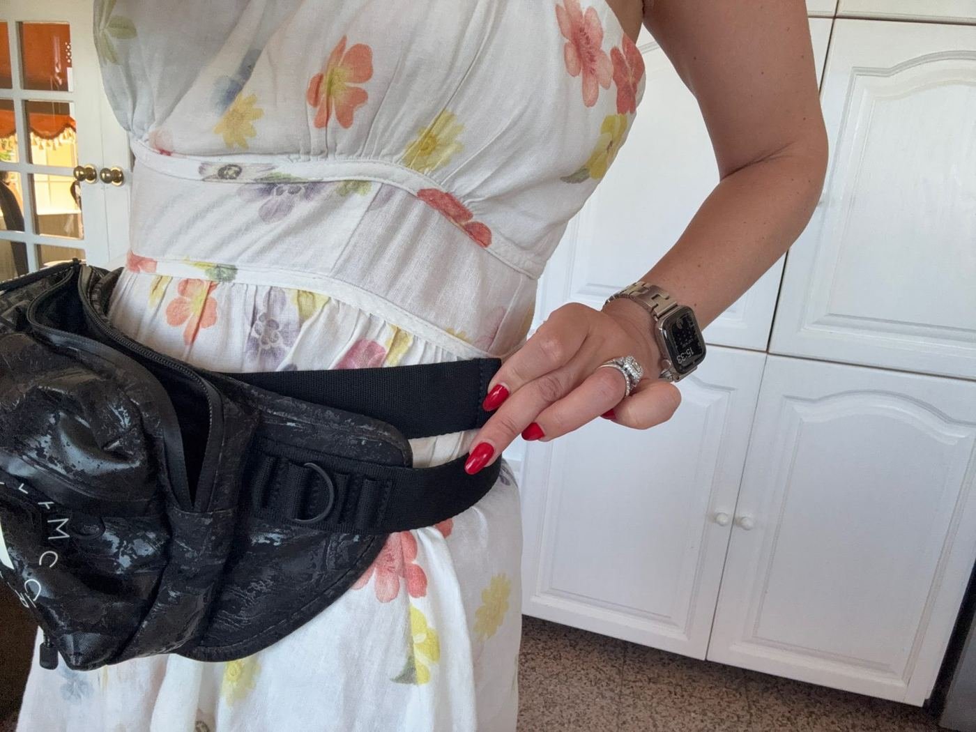 Tucking away the long extra strap on the bum bag
