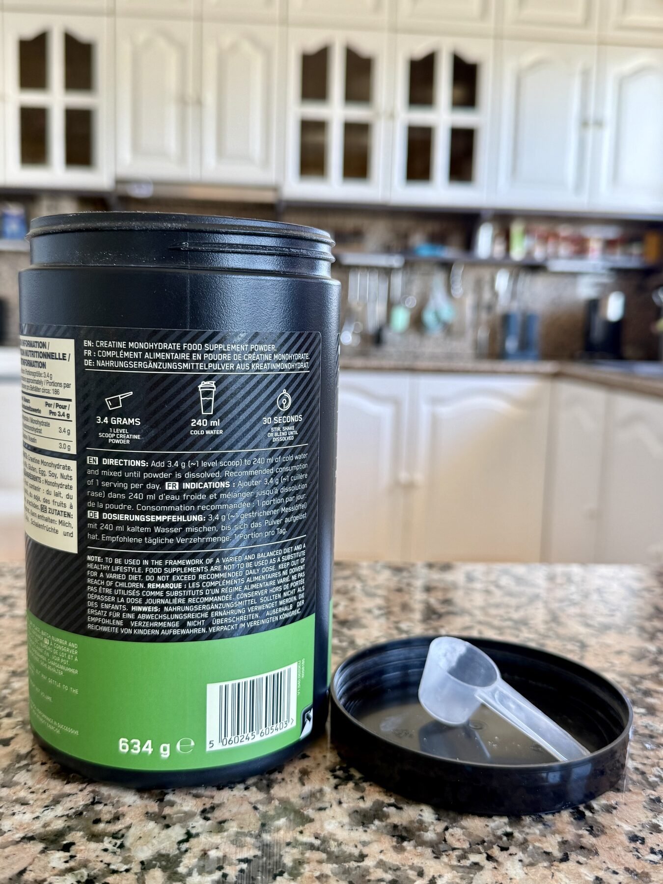 Back label of Optimum Nutrition Creatine Monohydrate showing dosage instructions and scoop